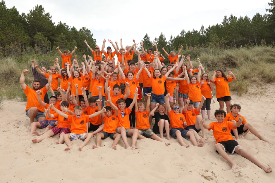 group of children on beach cheering